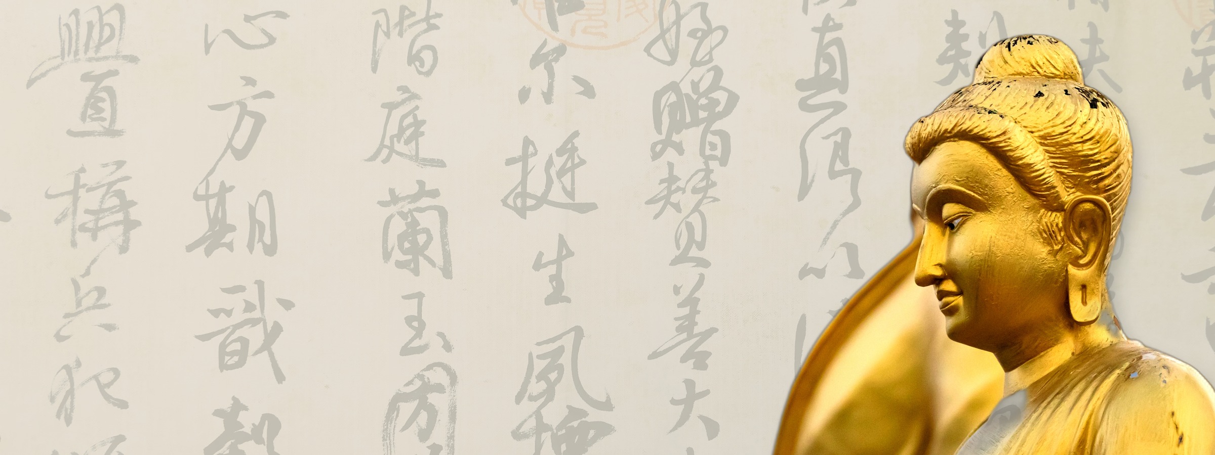Golden Buddha statue against ancient Chinese calligraphy